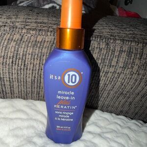 It's a 10 Miracle Leave-In Plus Keratin Spray — Purple & Orange Bottle